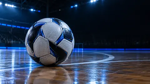 Bola de futsal em quadra iluminada